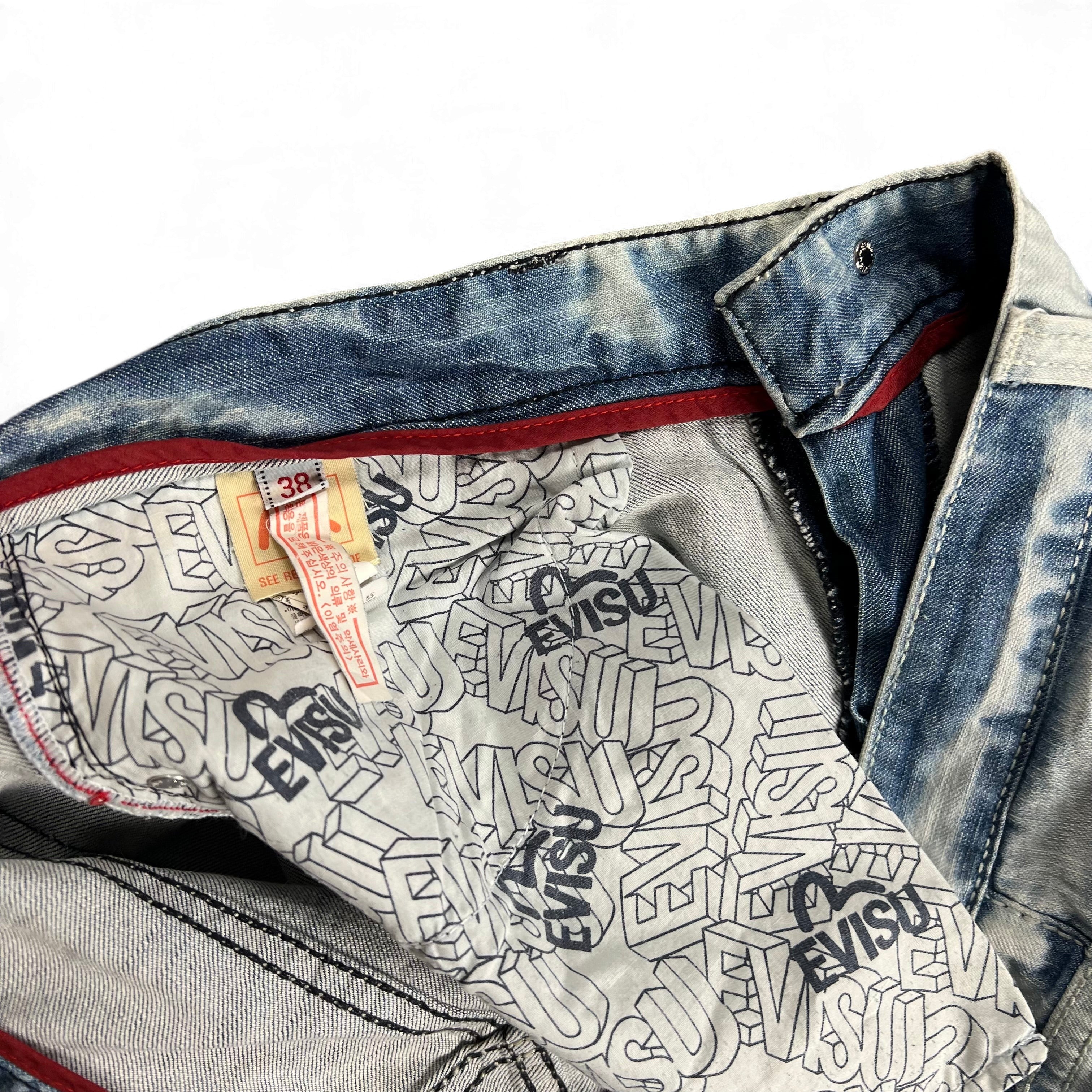 TWC Vintage Evisu KC Baggy Jeans mit Acid-Wash-Optik und markantem Logo-Innenfutter