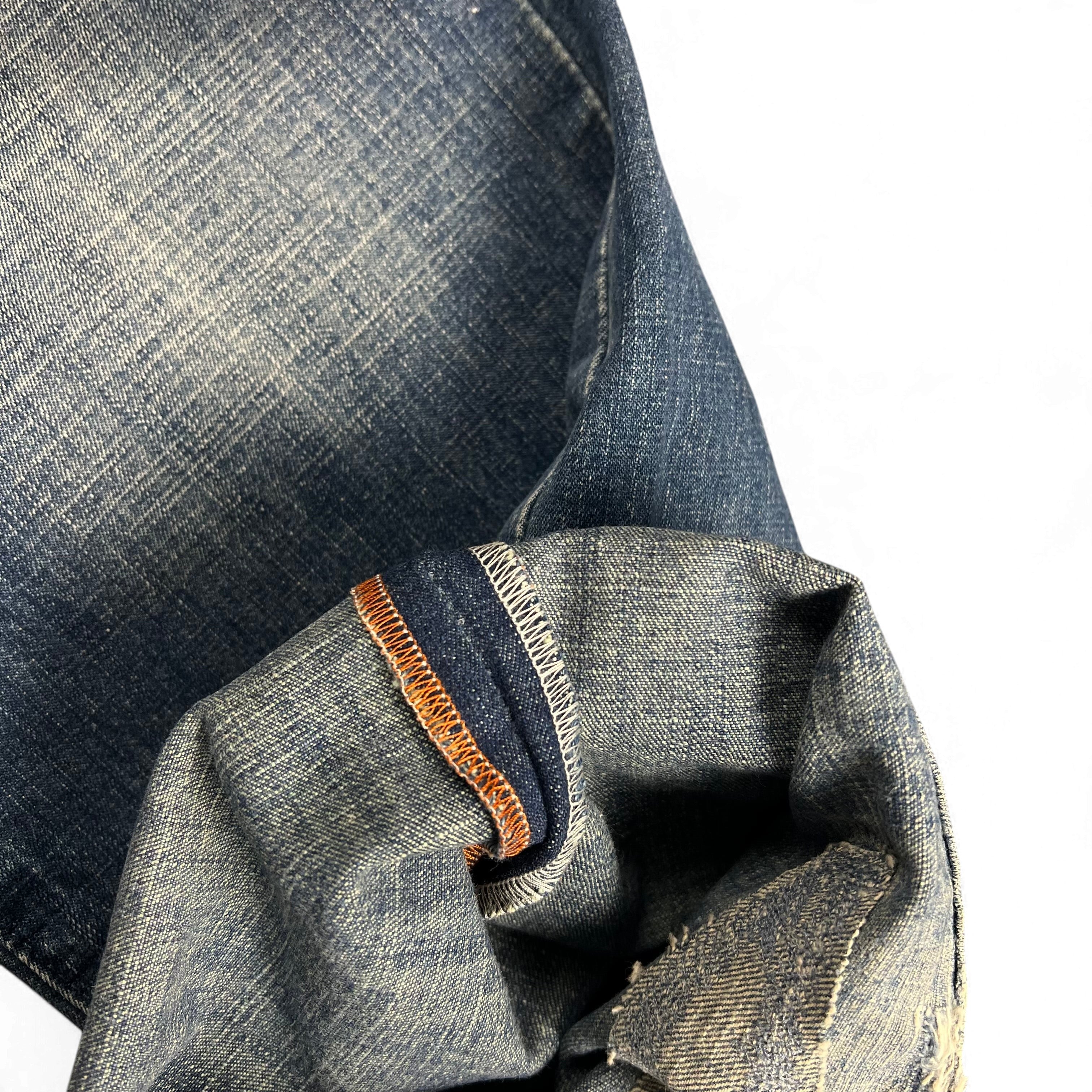 TWC Vintage Evisu Baggy Jeans Italy Edition aus blauem Denim mit markanten orangefarbenen Innennähten