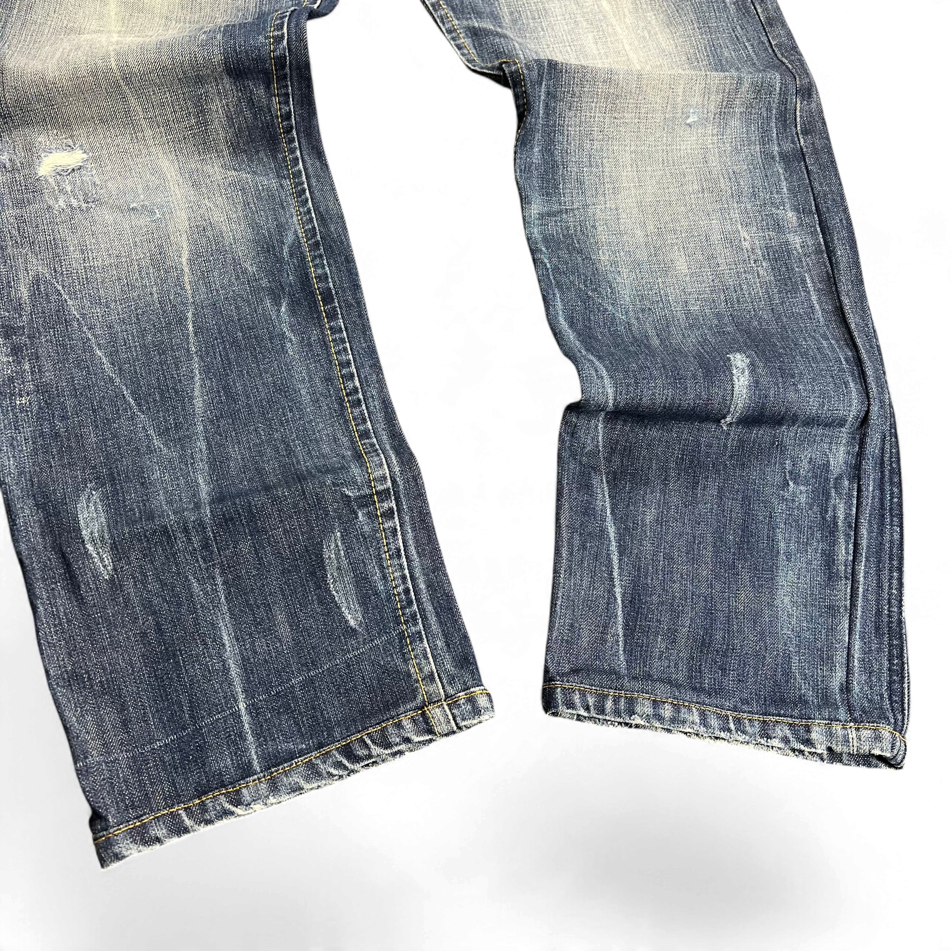TWC Vintage Diesel Darron Straight Jeans in blauem Denim mit Used-Look und Distressed-Details an den Beinen