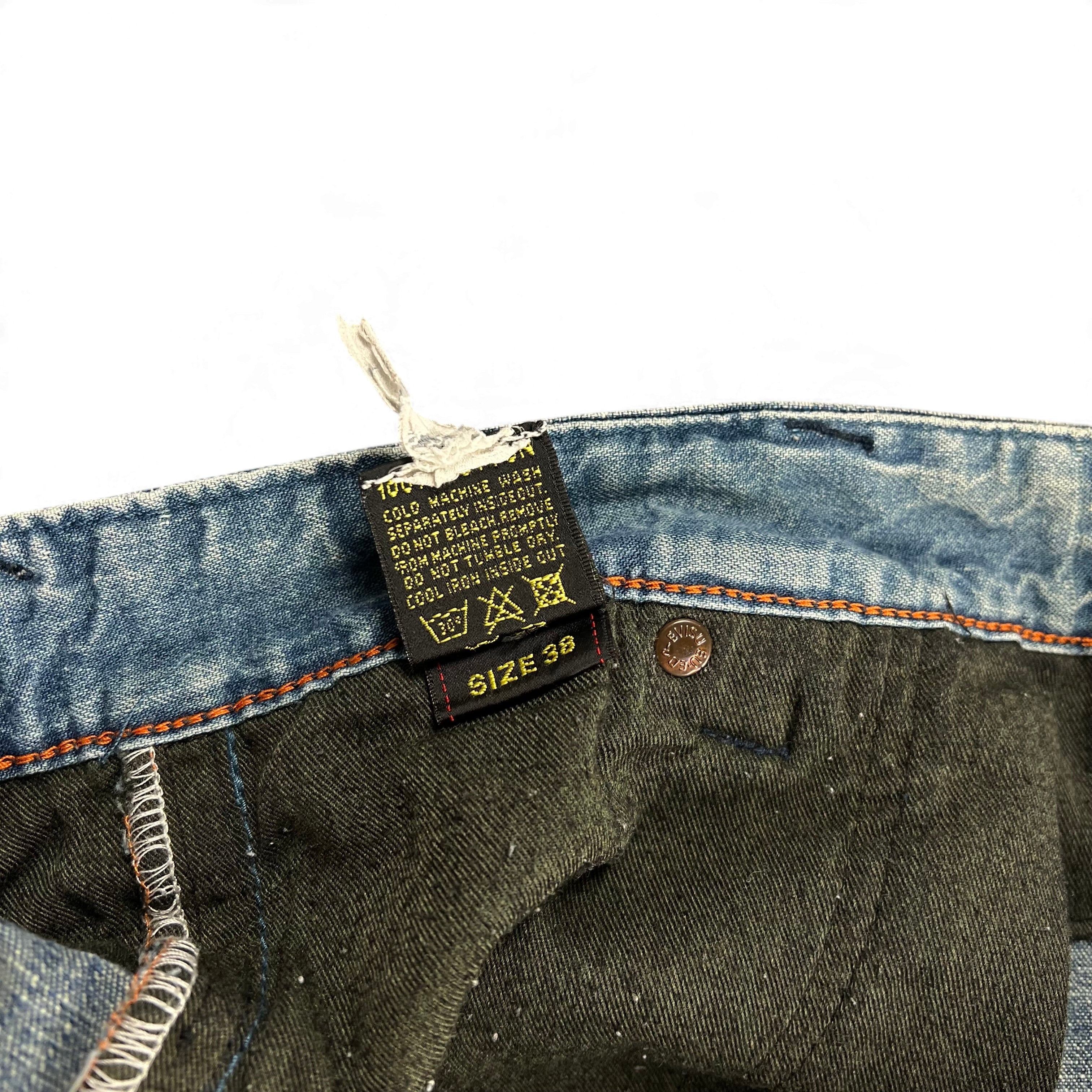 TWC Vintage Evisu Jeans Pflegeetikett mit Größenangabe 38 und Waschanleitung in blauem Denim
