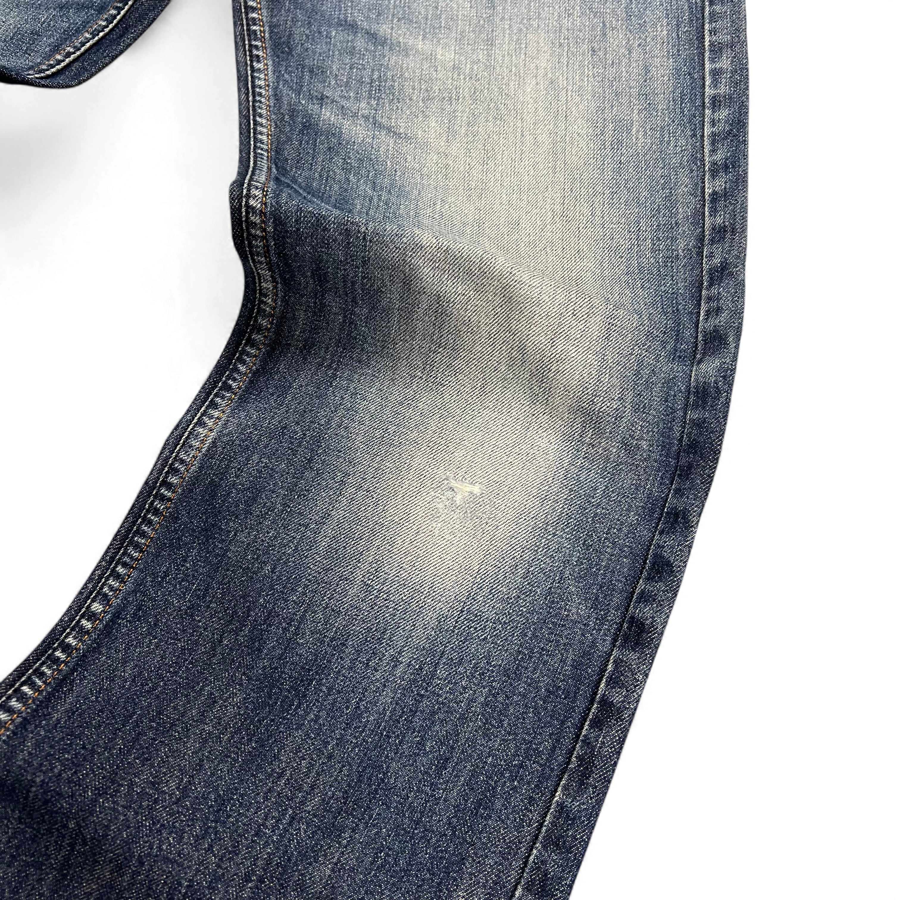 TWC Vintage Diesel Larkee Jeans in Blau mit Used-Optik und leichter Abnutzung am Knie