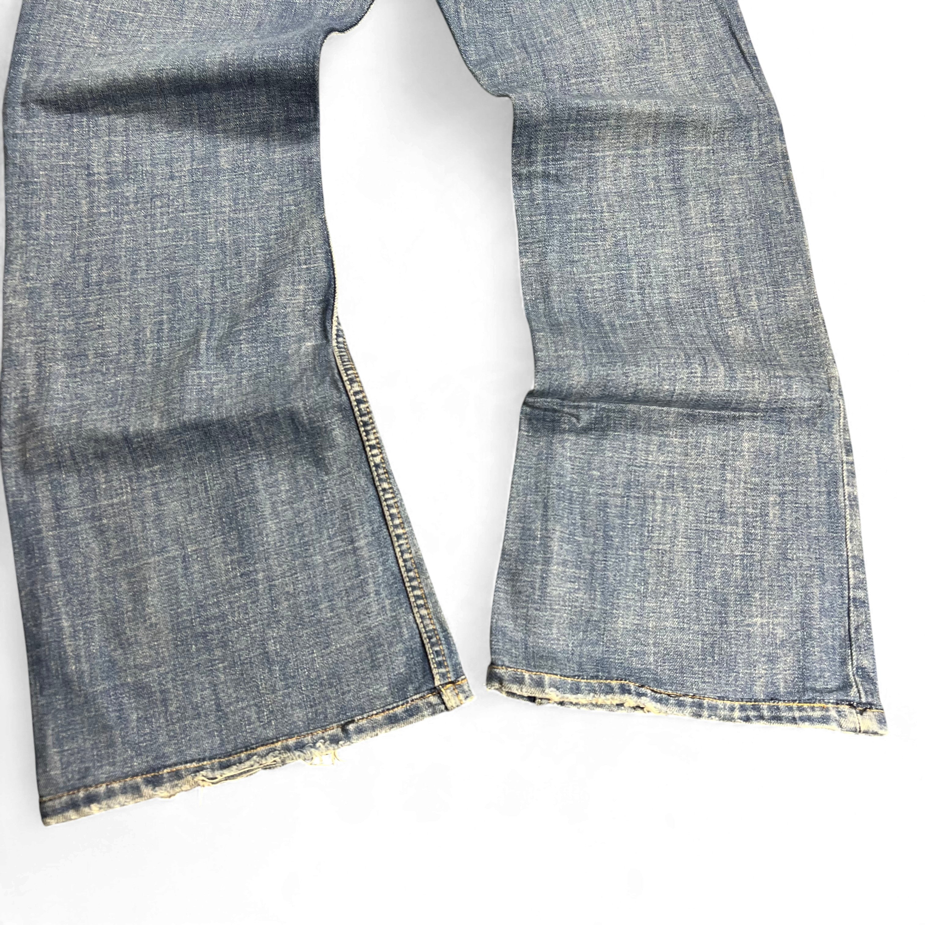 TWC Vintage Diesel Zathan Bootcut Jeans in verwaschenem Blau mit ausgefransten Beinabschlüssen