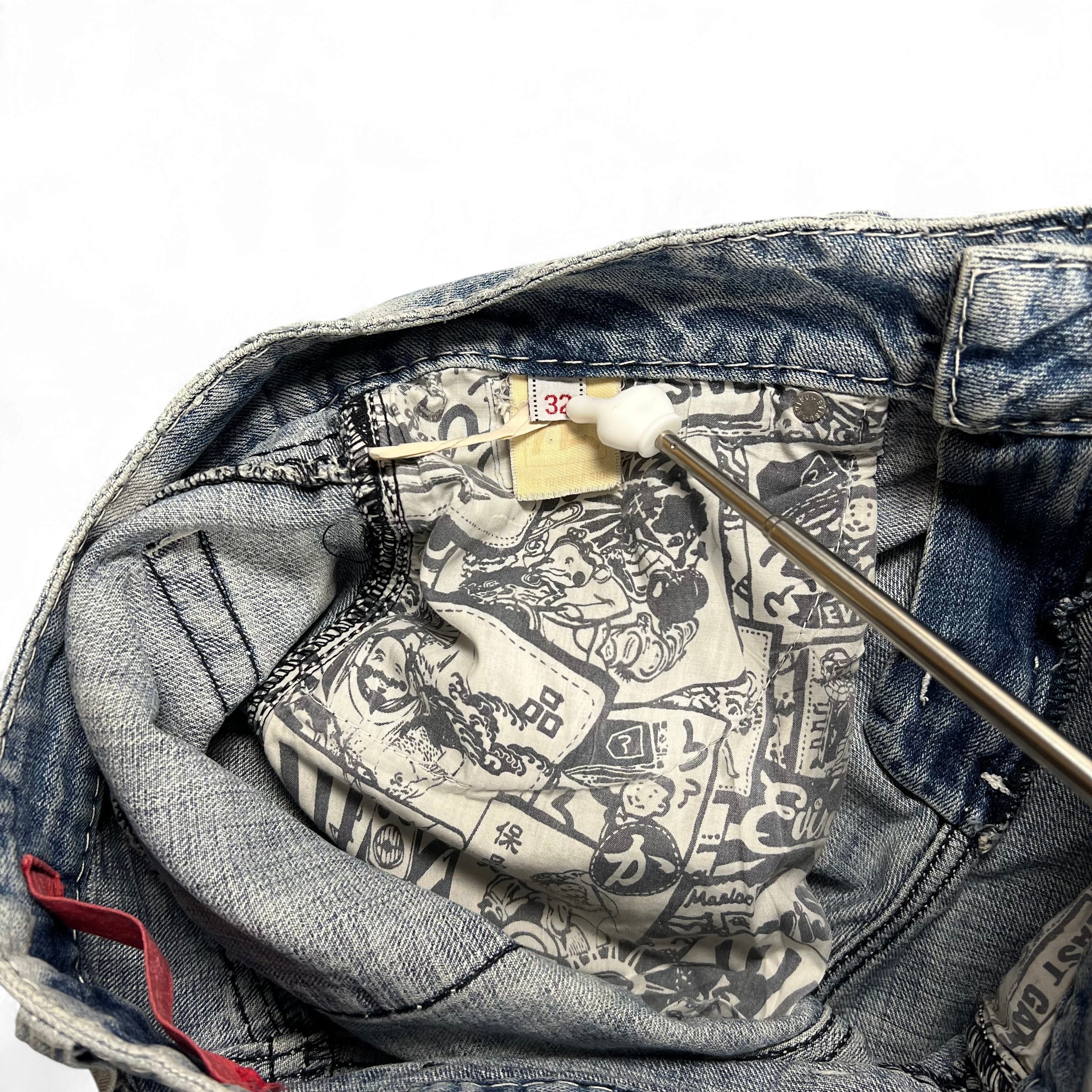 TWC Vintage Evisu KC Baggy Jeans mit charakteristischem Comic-Print Innenfutter und Etikettendetails