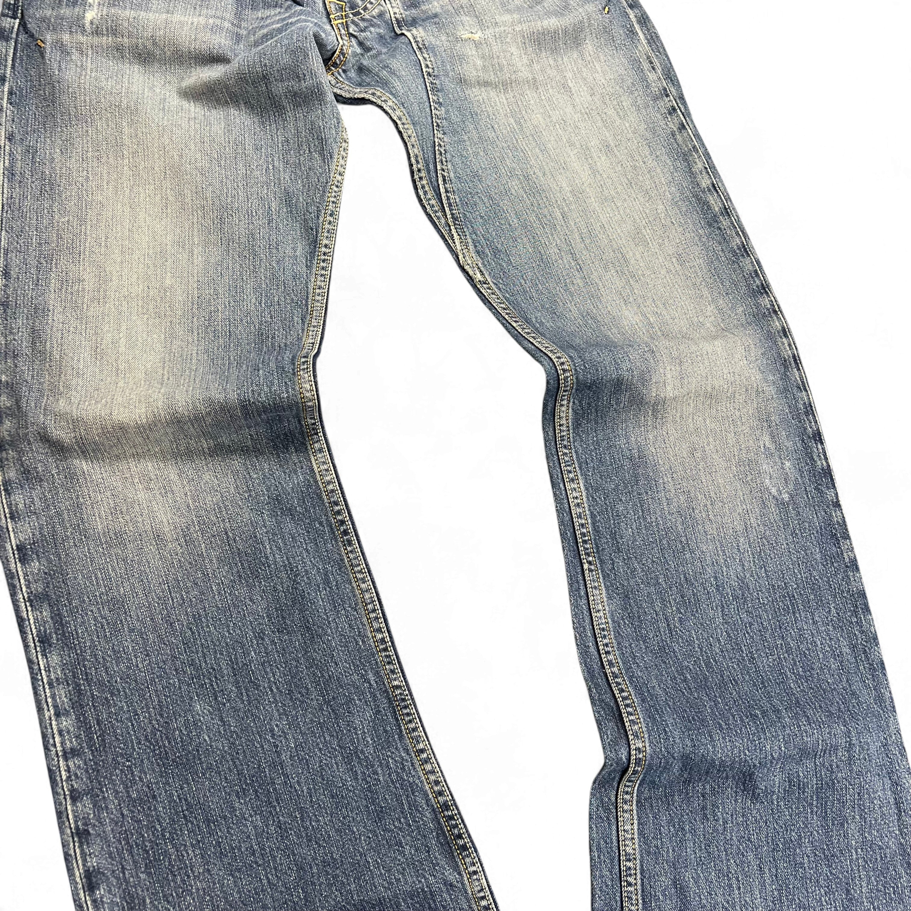 TWC Vintage Diesel Bootcut Jeans in verwaschenem Blau mit Used-Optik und markanten Nähten