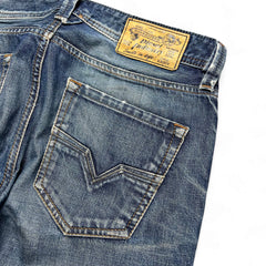 TWC Vintage Diesel Larkee Straight Jeans in verwaschenem Blau mit Lederpatch und markanter Gesäßtaschennaht