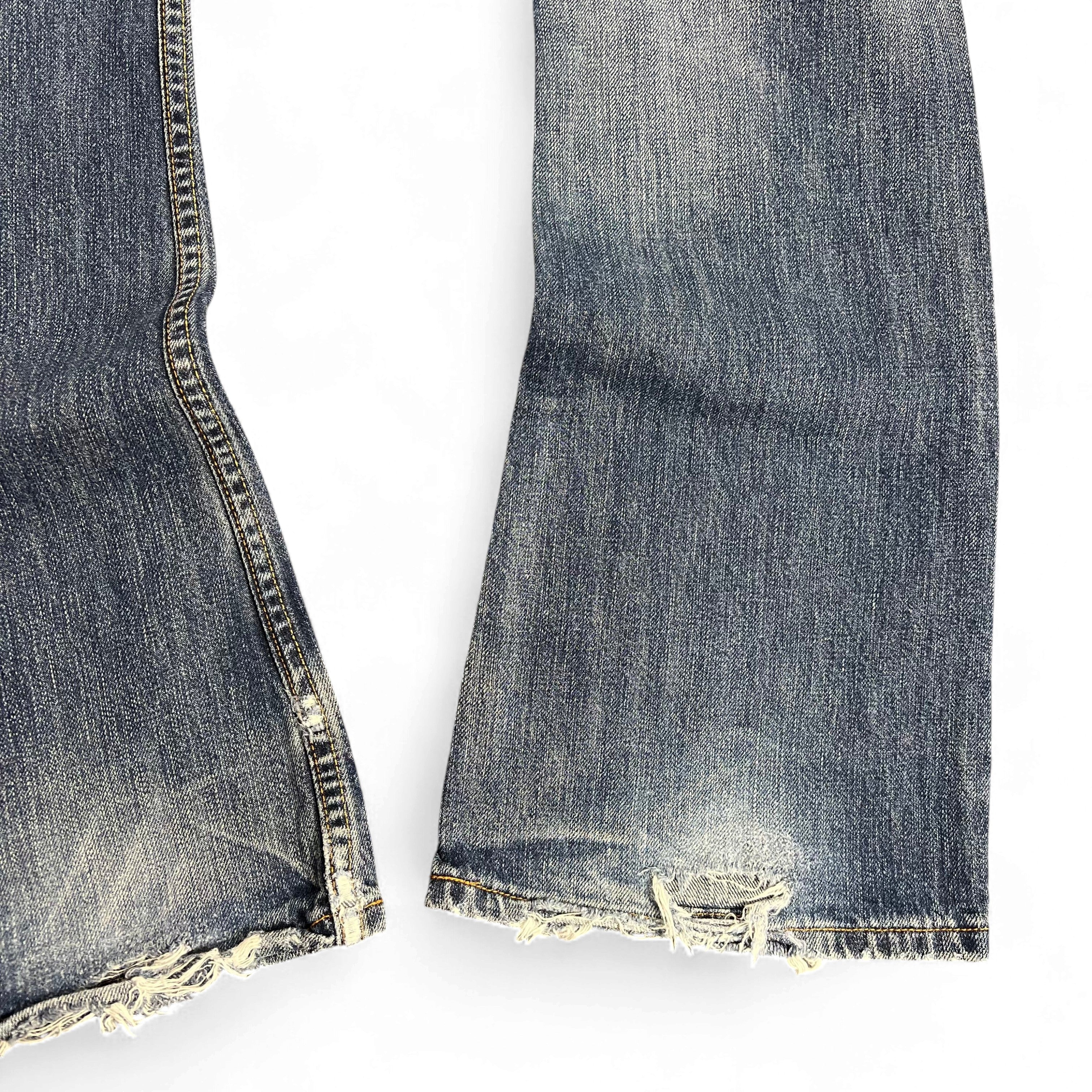 TWC Vintage Jeans mit verwaschenem Denim-Look und ausgefransten Säumen an den Beinabschlüssen