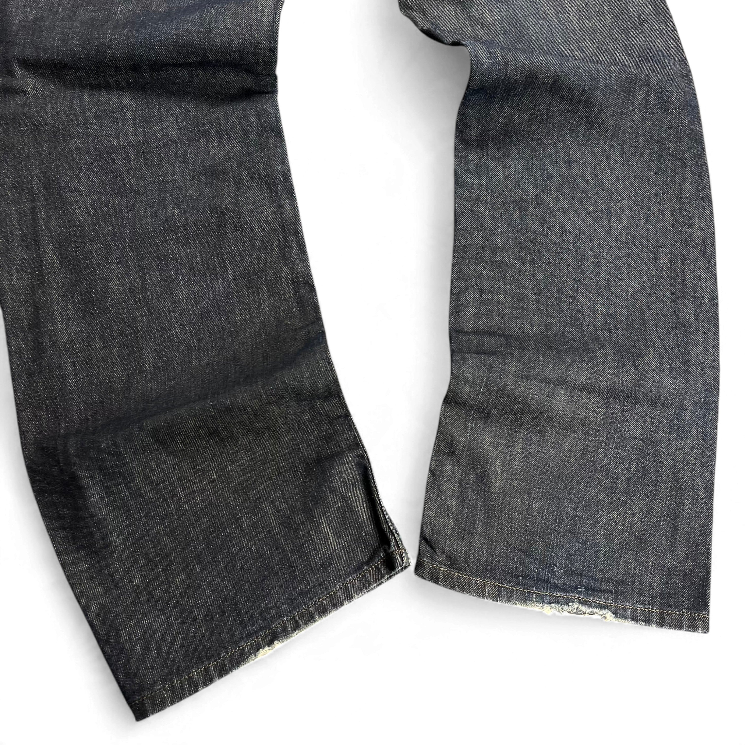 TWC Vintage Diesel Larkee Straight Jeans in dunkelblauem Denim mit geradem Bein und leichten Abnutzungsspuren am Saum