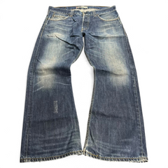 TWC Vintage Levi’s 512 Bootcut Jeans in verwaschenem Blau mit Used-Look und ausgefransten Säumen