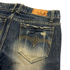 TWC Vintage Korean Bootcut Jeans in gewaschenem Blau mit Distressed-Details und dekorativer Gesäßtaschen-Stickerei