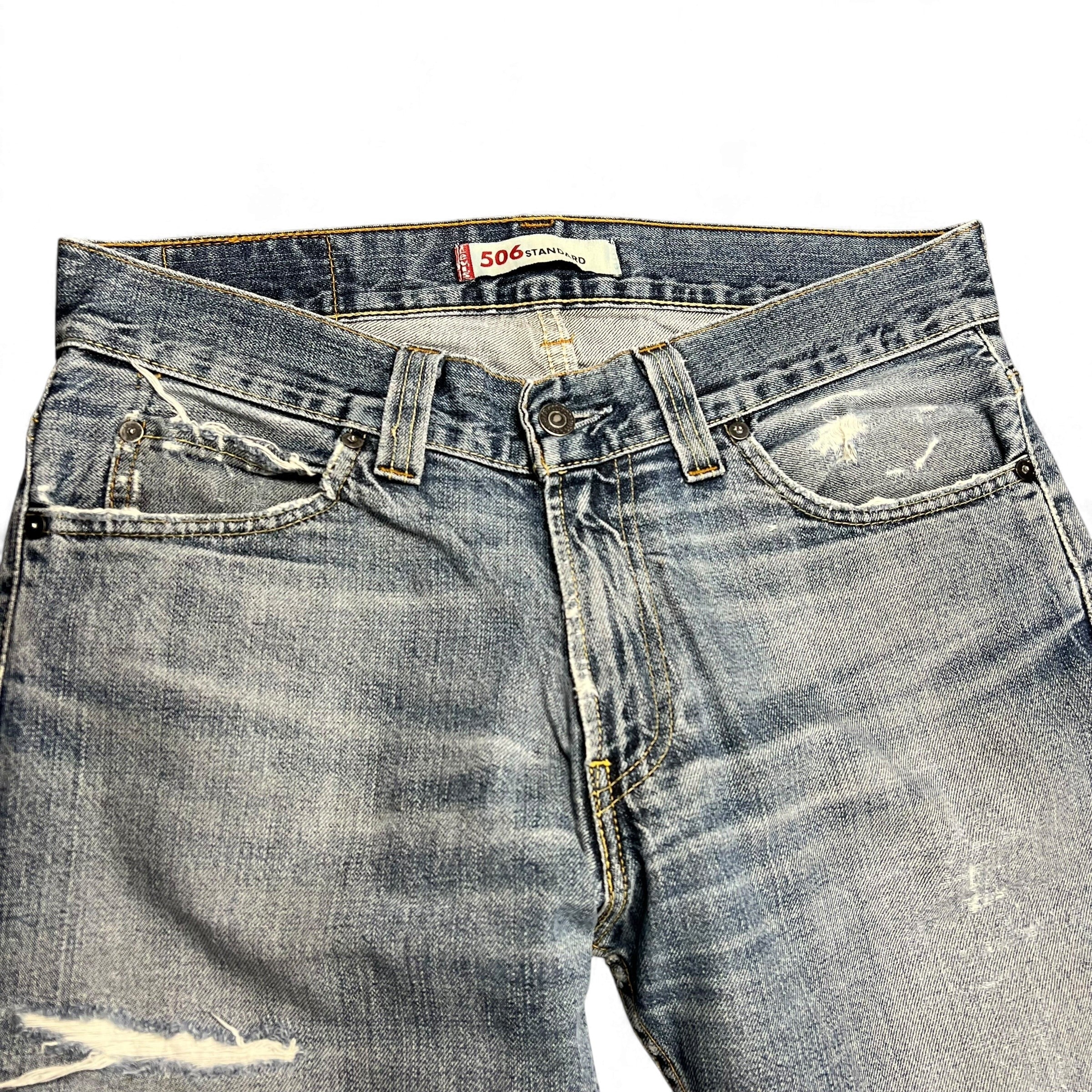 TWC Vintage Levi's 506 Straight Jeans in verwaschenem Blau mit Distressed-Details und klassischem Five-Pocket-Design