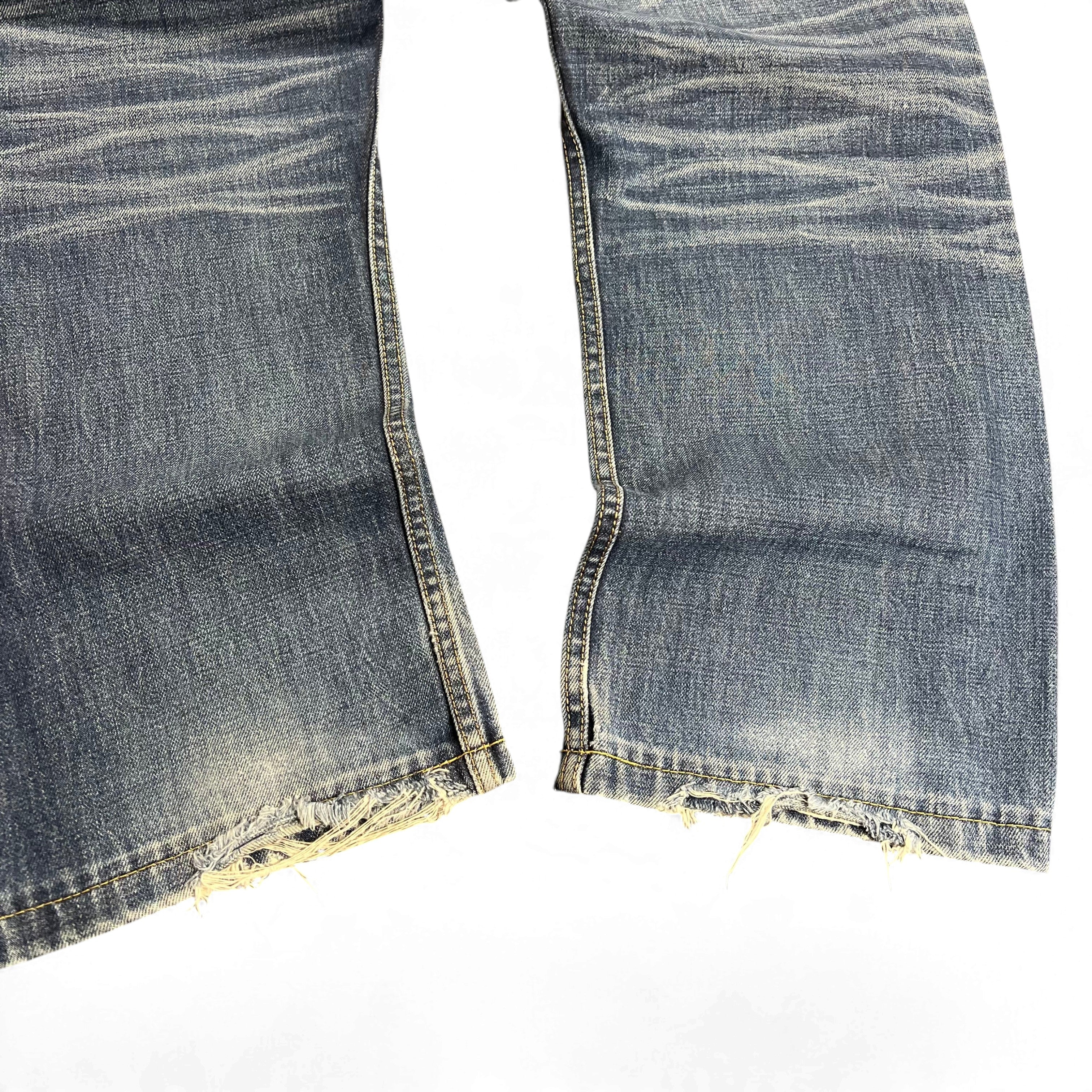 TWC Vintage japanische Selvedge-Jeans mit verwaschener blauer Waschung und ausgefransten Beinsäumen