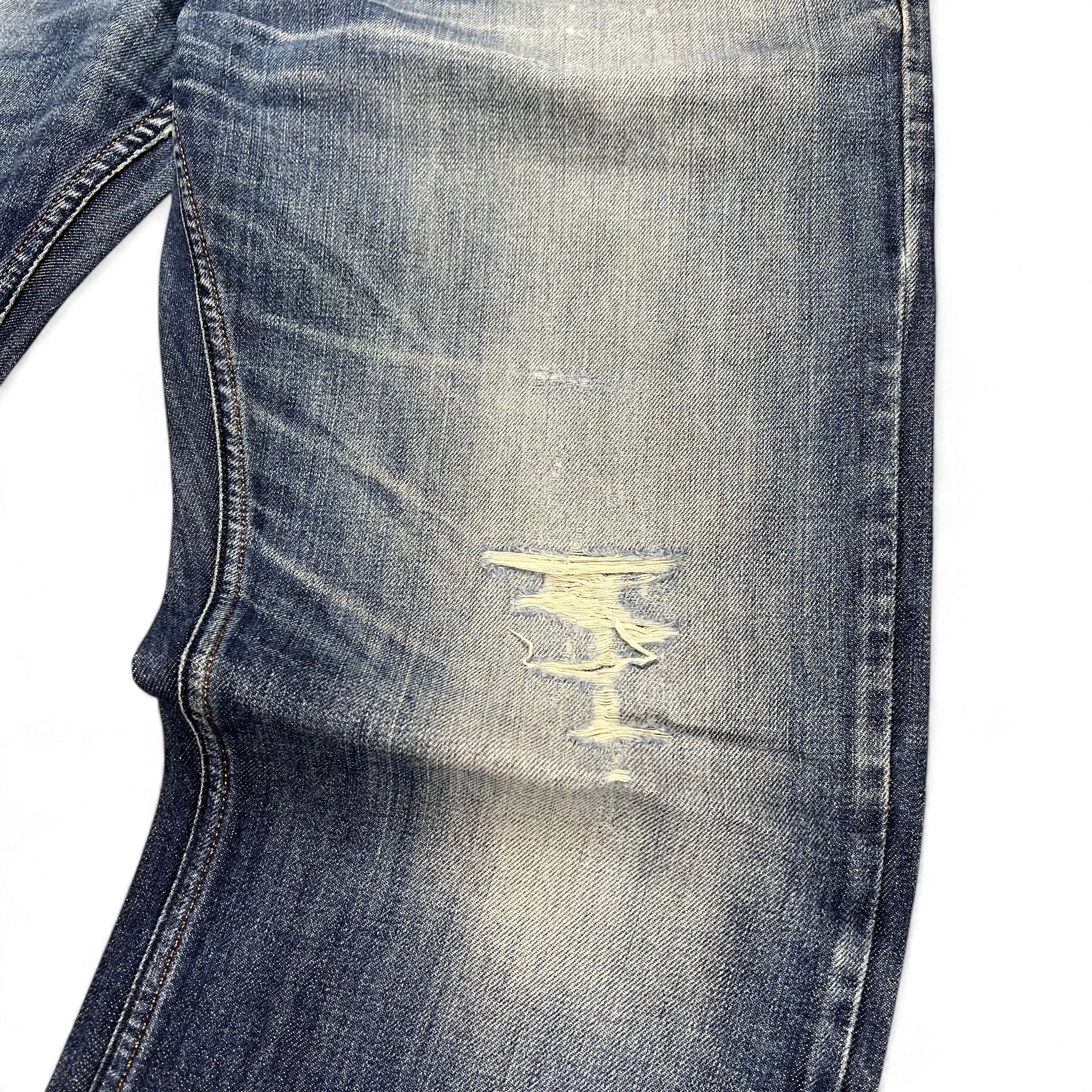 TWC Vintage Diesel Larkee Straight Jeans in blauem Denim mit Distressed-Details und Used-Look am Oberschenkel
