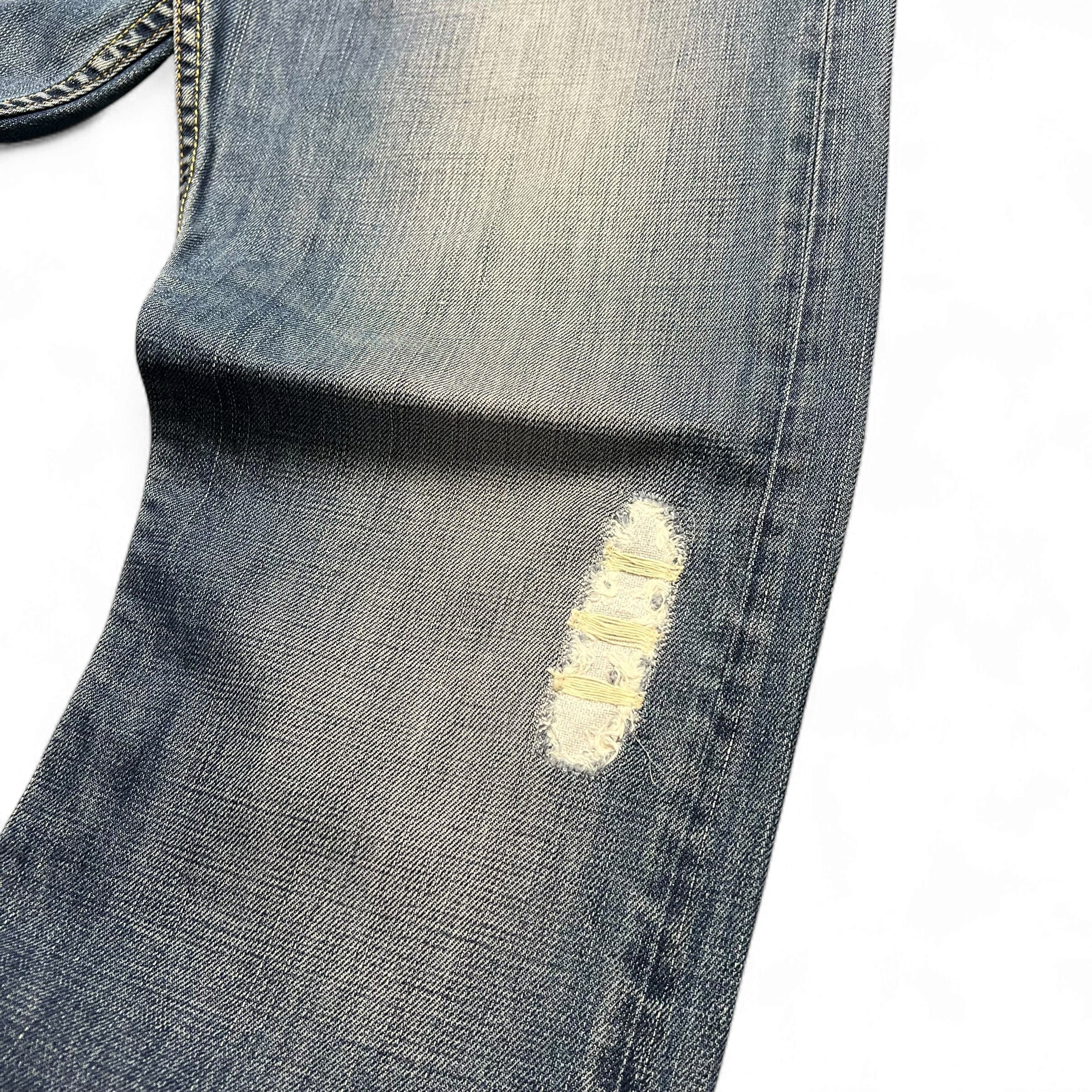TWC Vintage Levi’s 512 Bootcut Jeans in hellblauem Denim mit Distressed-Effekt und Rissen am Bein