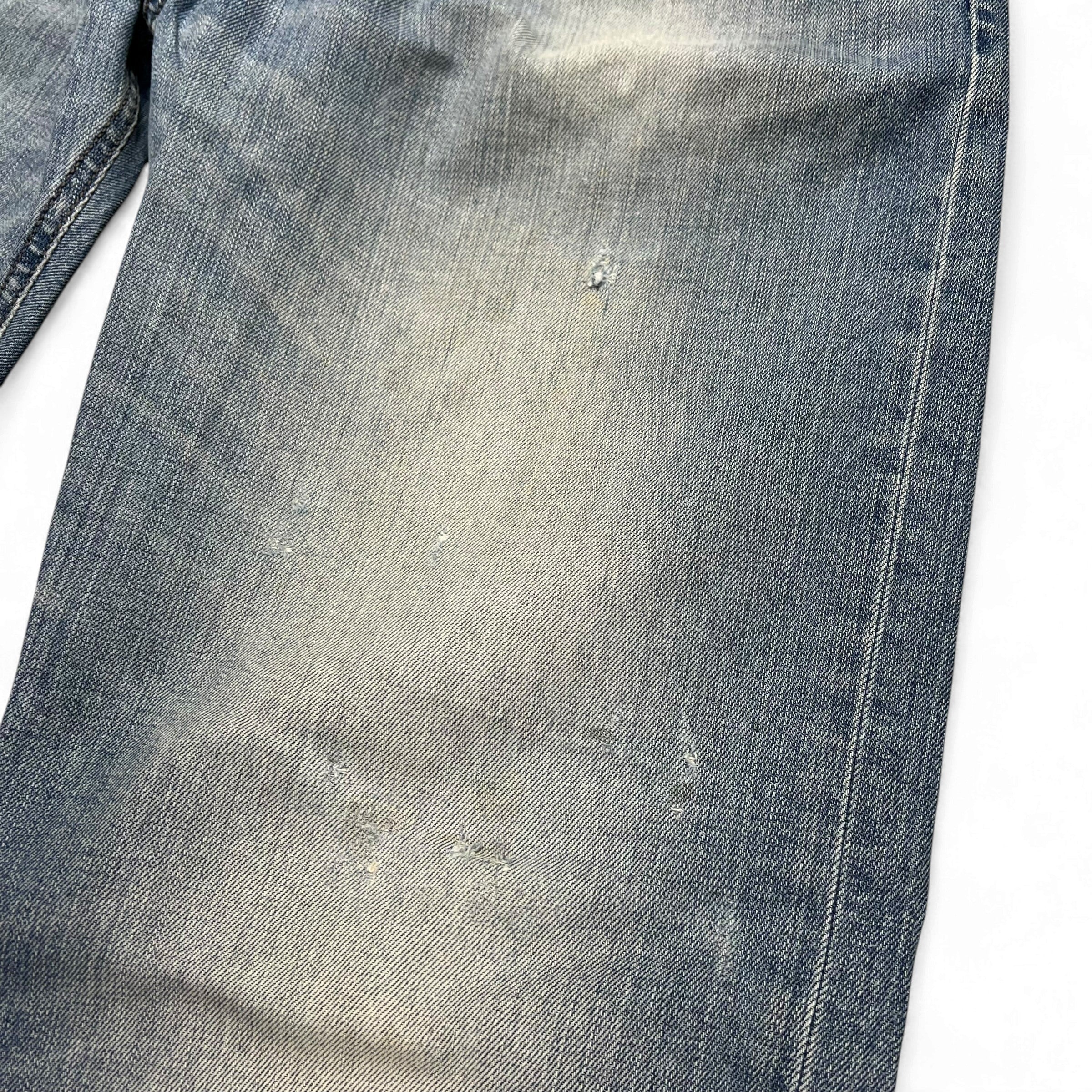 TWC Vintage Diesel Larkee Straight Jeans in hellblauem Denim mit authentischen Used-Look-Details und Abnutzungen