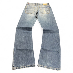 TWC Vintage Diesel Bootcut Jeans in blauem Denim mit Used-Look und Gesäßtaschen, Rückansicht