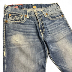 TWC Vintage True Religion Ricky Super T Jeans in blau mit markanten hellen Kontrastnähten und Used-Optik