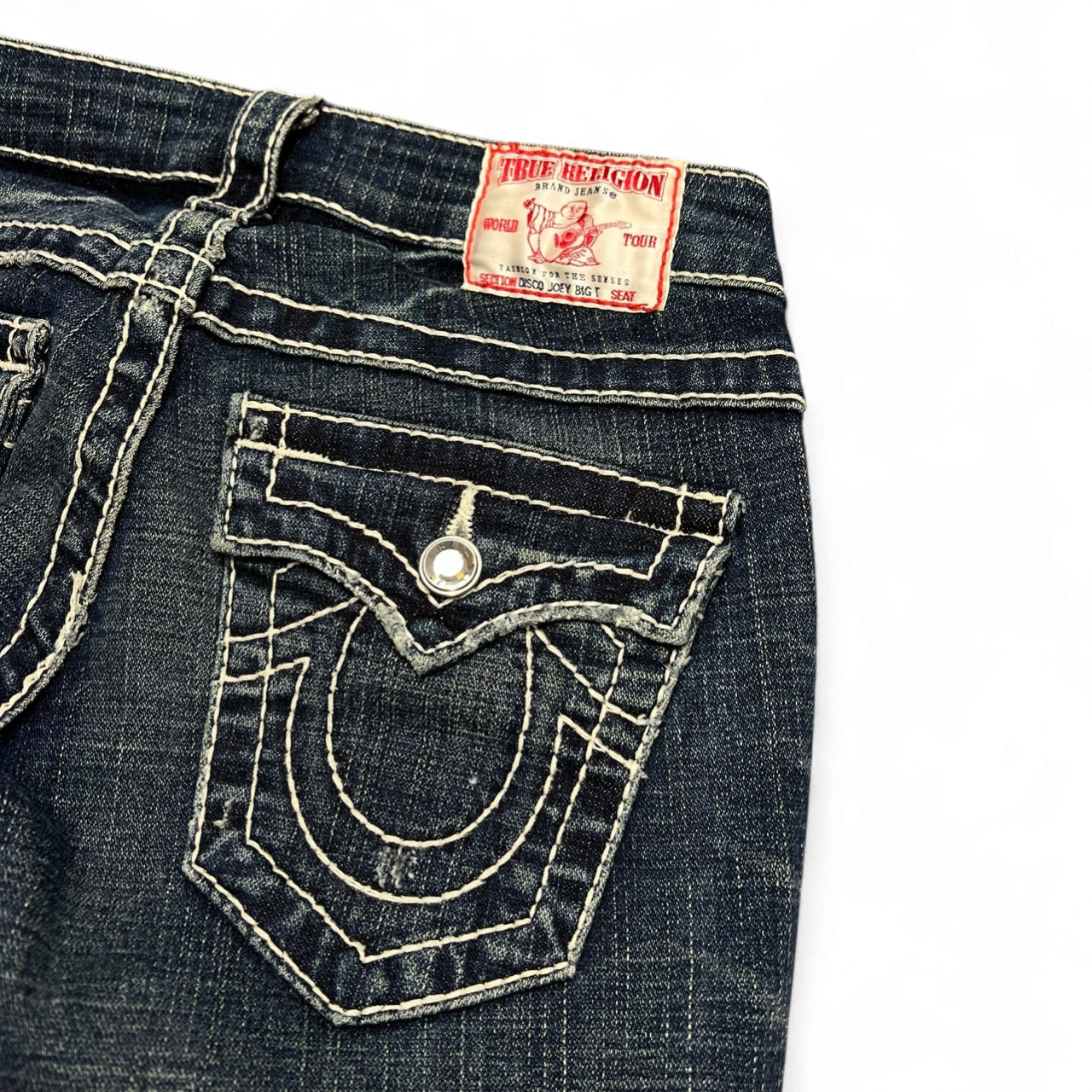 TWC Vintage True Religion Disco Joey Big T Damenjeans in Dunkelblau mit markanten hellen Kontrastnähten und Logo-Patch