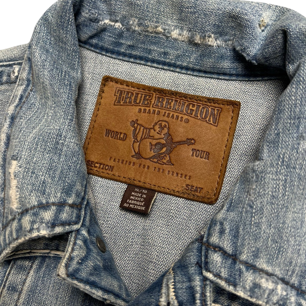 TWC Vintage True Religion Denim-Jacke mit braunem Leder-Label und Used-Look-Details am Kragen